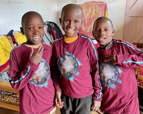 Children receiving new clothes in 2024